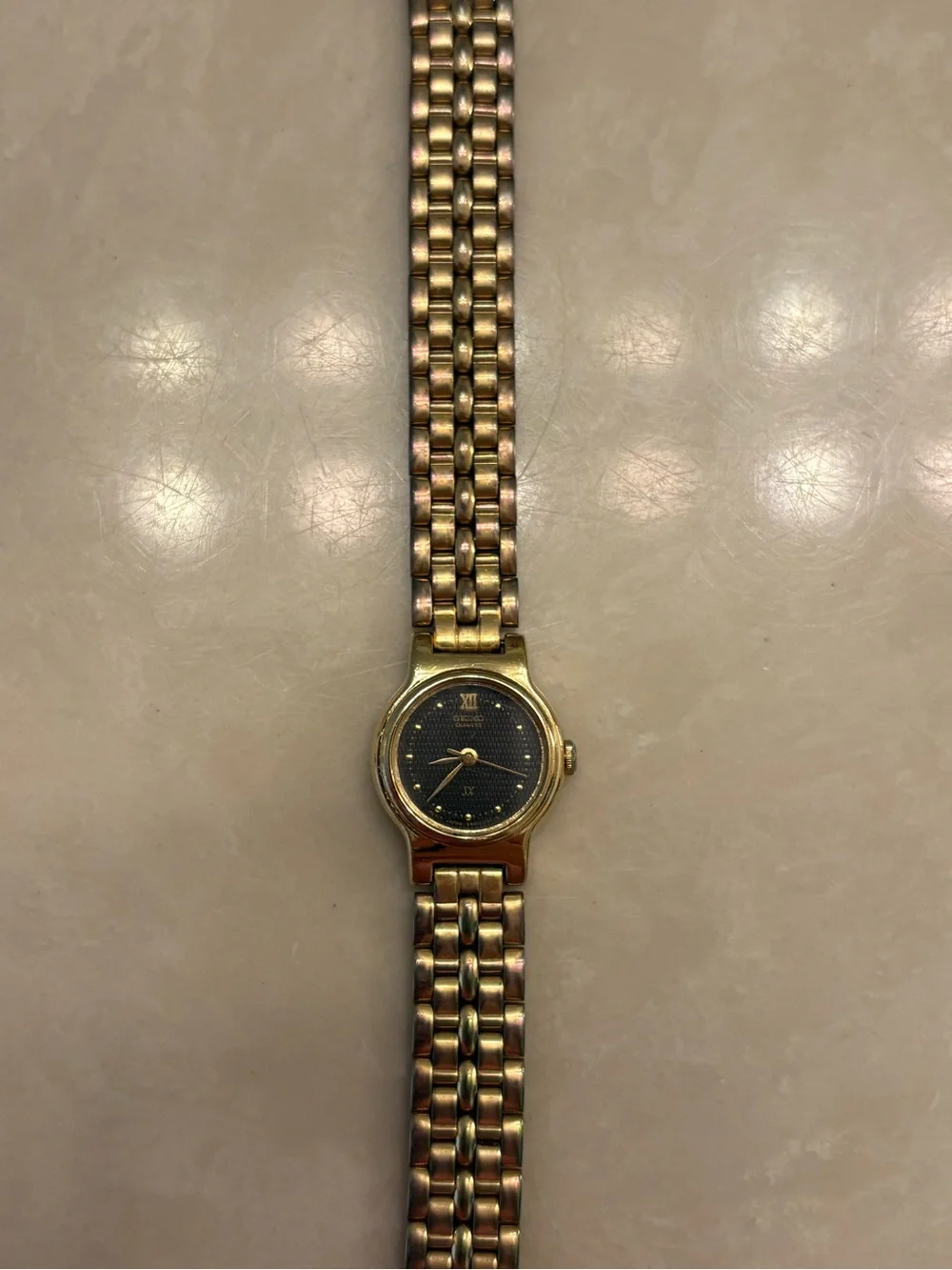Vintage Seiko Women's Gold-Tone Bracelet Watch with Black Dial